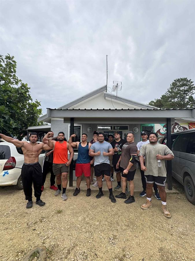 The crew outside the gym building